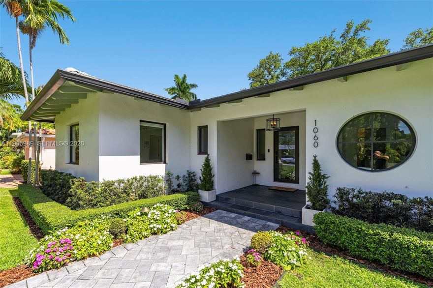 Discover luxury living in one of Miami Shores’ most exclusive locations, just steps from Biscayne Bay. This fully renovated, modern smart home is surrounded by lush landscaping and designed with eco-friendly, family-safe materials. Light-filled interiors feature crown molding, expansive windows, and an open layout that connects a chef’s kitchen, formal dining room, and private office. The serene primary suite offers his-and-hers custom walk-in closets, a sitting area, and double French doors leading to a shaded patio—perfect for relaxing. Experience the charm and elegance of this exceptional home today!
