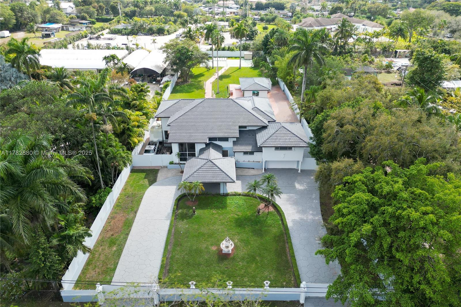 **NEW ROOF & Fresh Outdoor Paint** A luxurious oasis in Horse Country Estate on a full acre lot of paradise. An amazing entry into a Porte-Cochere as drive up a circular driveway. The front double doors lead you to the relaxing sound of water falling down a stone pond. Home has 8 bedrooms and 5 full bathrooms in main house, 2 car garage, office, recreational room, marble floor throughout the first floor. It has a beautiful wraparound covered terrace overlooking the pool and tennis court. The Guest House/In-Laws has 2 bedrooms and 1 full bathroom. Also having its own covered area. New roof added dec 2024. all a/c new from 2021 present.