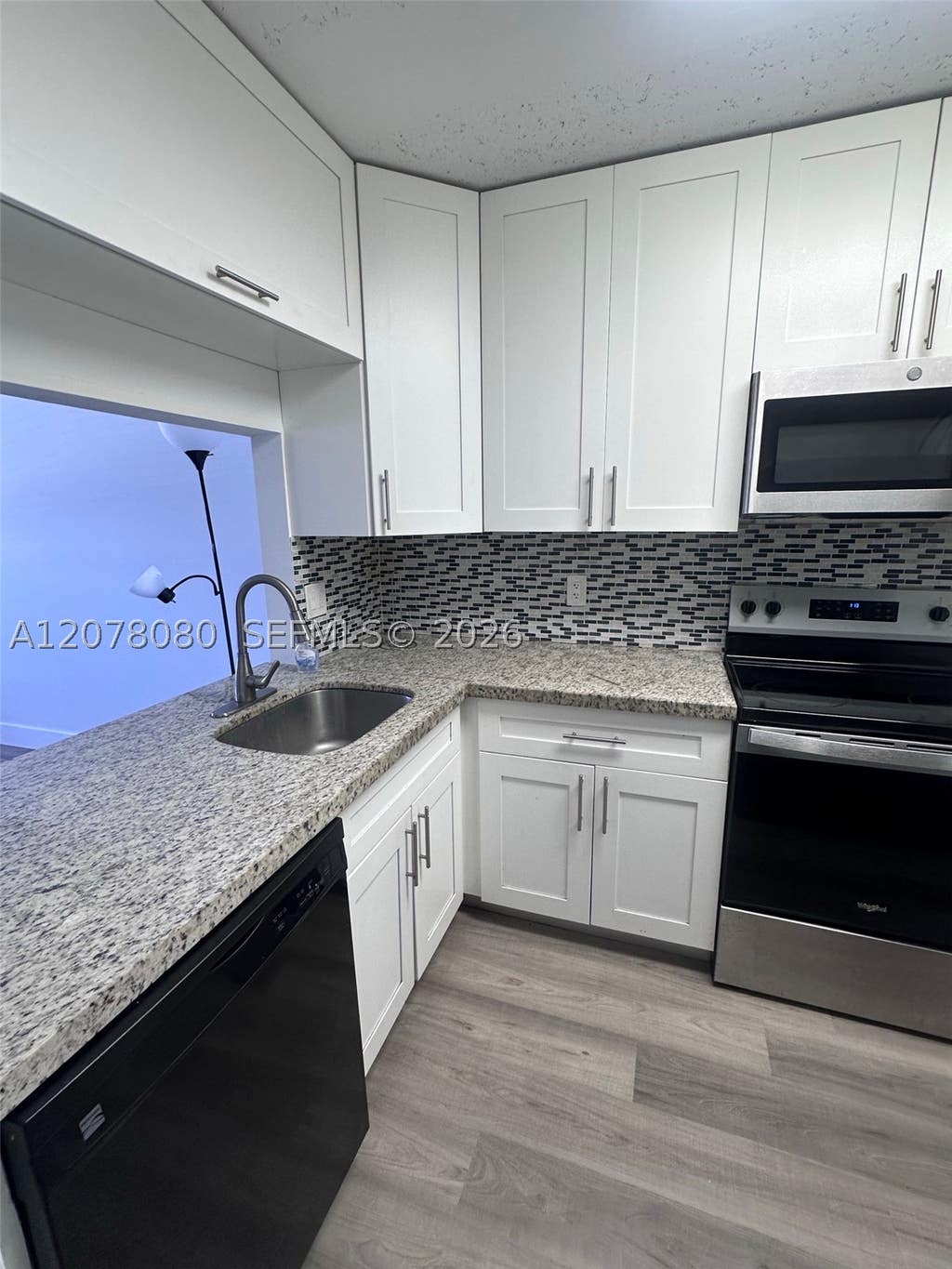 Photo of 10049 Winding Lake Rd #103, Sunrise, FL 33351 (MLS # A12078080)