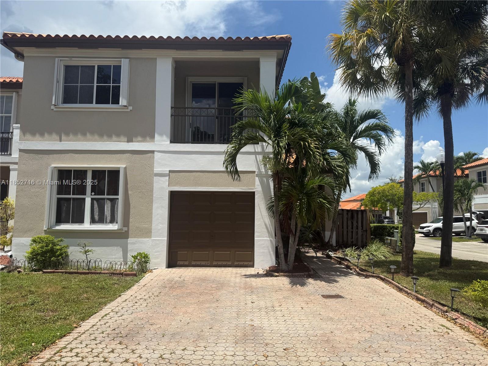 Spacious townhouse in a corner lot with 4 bedrooms & 3 bathrooms, located in a desirable Anchorage at Miami Lakes, a gated community. The first floor has a bedroom and a full bath, offering flexibility for guests or in-laws.. Tile floors throughout, a formal dining, family, and living room. Huge master bedroom with extra seating. Walk-in closets. Master bathroom featuring double sinks, a garden tub, and a separate shower. Freshly painted interior and exterior. New roof installed less than 6 years ago. Brand new AC unit, one-car garage. Fenced-in patio with additional storage room. Magnificent pool with a lake view. Family-friendly and quiet atmosphere. Great neighborhood with A+ schools. Nearby parks offer activities. Owner-occupied, appointment only. Request a show assistant.