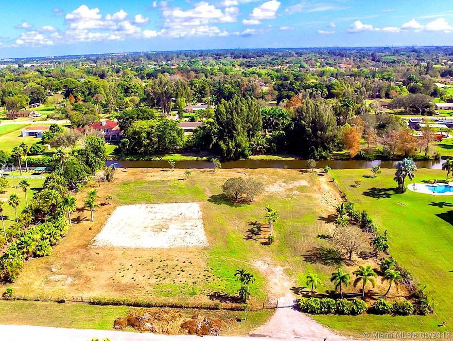 The potential this waterfront 2.43 acred lot has to build the house of your dreams is truly unmeasurable. Nestled in the middle of South Florida's two biggest city, Miami & Ft. Lauderdale, this lot is the ideal place for a beautiful, massive home. Best of both worlds, Country & City, this lot is located in South West Ranches at the end of a dead-end street. After hustling the streets of Miami this getaway spot, close to major highways, takes you back to the country where a 5,500SqFt Pad is already built for your dream ranch/equestrian home with a second 3,500SqFt Pad as well. Awesome! Million dollar homes and Ranches with livestock also surround the land, A+ School's and all Weston has to offer. Lot has been responsibly maintained, ready to be built on, ready for new memories! Own it!