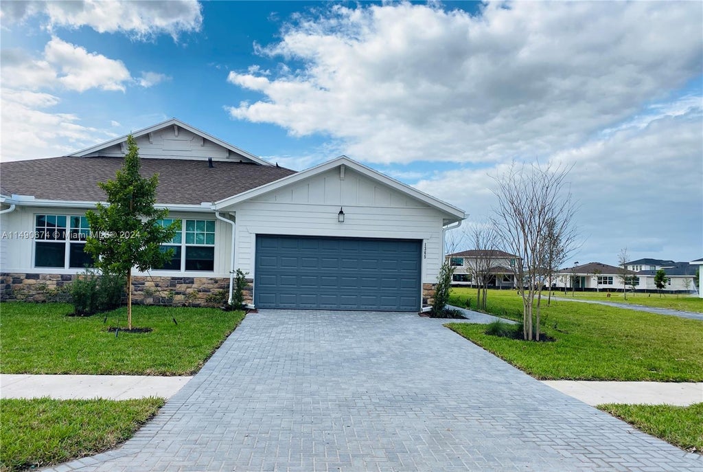 Photo of 1365 Haywagon Trl, Loxahatchee, FL 33470 (MLS # A11490674)