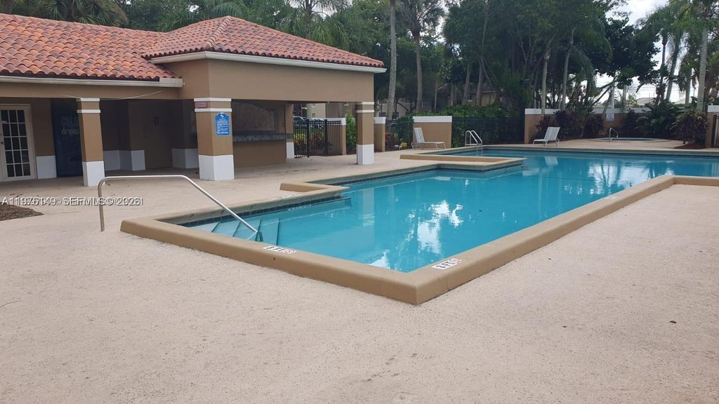 Photo of 1251 N Benoist Farms Rd #304, West Palm Beach, FL 33411 (MLS # A11976149)