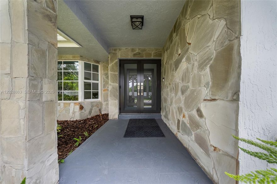 Country Walk Estate at its best. CBS construction featuring 4 bedrooms, 2.5 bathrooms, an oversized family room, and a 2-car garage. Full impact windows and doors throughout. Interior features 24" x 48" tile flooring throughout and wood flooring in the primary & fourth bedroom. Spacious kitchen with wood cabinetry, pull-out shelves, quartz countertops & backsplash, and a snack counter. Large picture window overlooks the renovated pool, marble deck, and lush landscaping.
Additional features include plantation shutters, crown molding, 6-inch baseboards, rain gutters, automatic well-fed sprinkler system, alarm system, interior laundry room with abundant cabinetry, and quartz countertops. Pride of ownership is evident throughout. Located in a well-established community with convenient access to schools, parks, shopping, and major roadways.