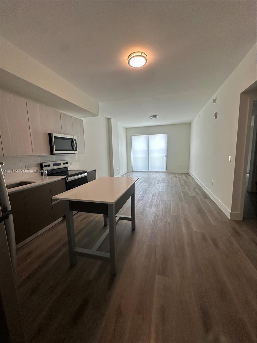 2 MONTHS FREE, spacious studios, one-bedroom, one-bedroom + den, two-bedroom, and two-bedroom + den residences, including flexible live-work units—each thoughtfully designed to blend style, comfort, and function. Step into open-concept layouts featuring designer finishes, premium appliances, 9-foot ceilings, walk-in closets, private patios, and in-unit washer and dryers. This boutique-style community offers a refined amenity package, including a Peloton-equipped fitness center, resident café and lounge, professional podcast studio, children’s playroom, and an elevated outdoor terrace perfect for relaxation or entertaining. Enjoy the charm of a peaceful neighborhood with the convenience of city living—just minutes from Fort Lauderdale beaches, top dining, shopping, and Jaco Park.