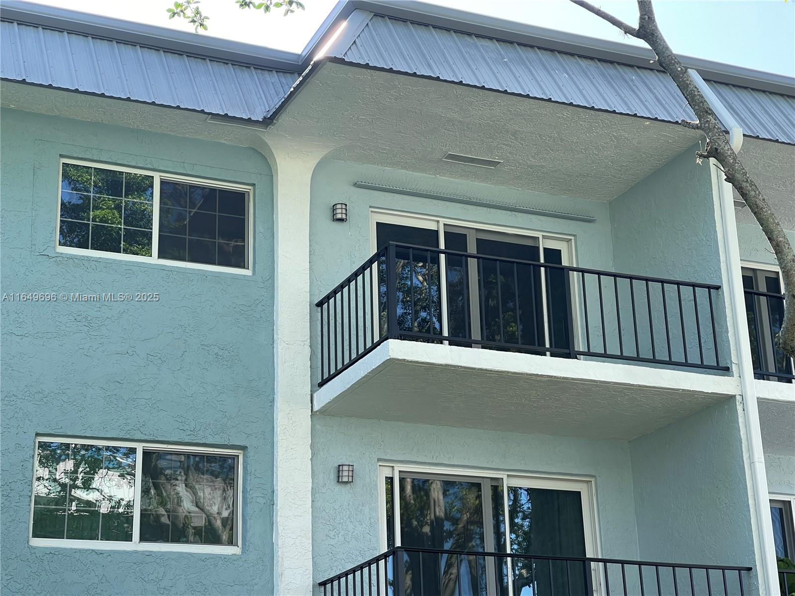 Best Price! No Assessments. A half mile to the restaurants, shops, & nightlife on Wilton Drive and 2.5 miles to the Beach. HOA has completed SIRS. Third floor 2 bed/2 bath with balcony facing the garden courtyard. Garden views from the living room & bedrooms. One assigned parking space & plenty of guest parking. Bedrooms are spacious with walk-in closets. Separate living & dining rooms. All windows & the living room sliding door are hurricane Impact Glass. Building roof & gutters replaced in 2022. Exterior building painted 2025. Community amenities include a heated pool, fob entry clubhouse with kitchen facility, & BBQ patio area. HOA fees include water, pest control, WiFi. Common laundry rooms on each floor & shared extra storage space on this floor. A grocery store is across the street.