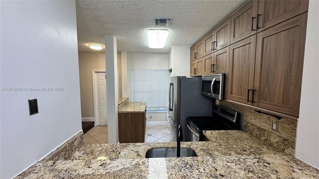 Photo of 443 SW 122nd Ter, Pembroke Pines, FL 33025 (MLS # A11873942)