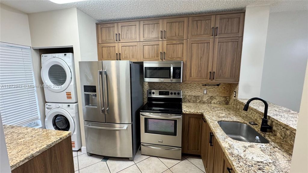 Photo of 443 SW 122nd Ter, Pembroke Pines, FL 33025 (MLS # A11873942)