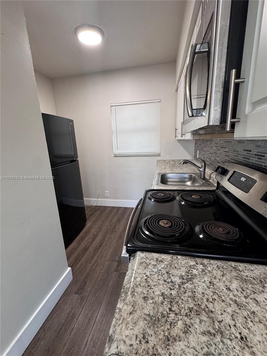 This spacious studio apartment is situated in a highly desirable location in Hollywood, specifically on North Federal Highway. The unit features a full bathroom that includes a bathtub and provides hot water. The kitchen is fully equipped with an oven and microwave, ensuring convenience for residents. Rent is $1,250.00 per month + $55.00 water fee. Electricity is not included. 1-year lease min. Deposits for move-in: 1st month's rent, last month, and a 1-month security deposit.