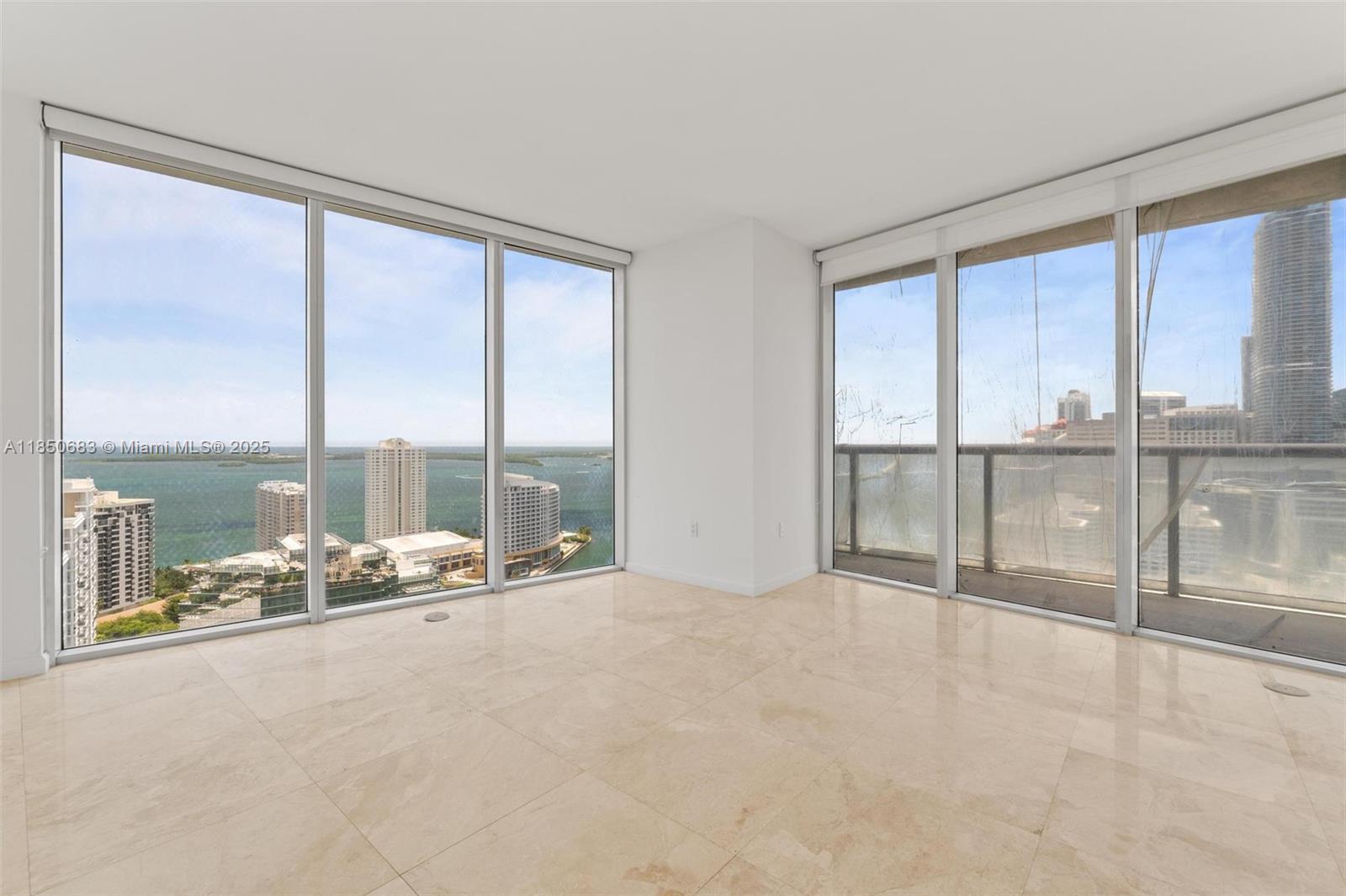 Step into luxury in this luminous and expansive corner residence, where every room offers stunning panoramic views of Biscayne Bay. This impeccably designed home features elegant marble and rich flooring, a modern European-style kitchen, and a spacious balcony—ideal for relaxing or entertaining while taking in the waterfront vistas. Indulge in a resort-style lifestyle with access to world-class amenities, including an infinity-edge pool, full-service spa, state-of-the-art fitness center, private theater, billiards lounge, party rooms, and on-site gourmet dining. Nestled in Brickell’s thriving financial district, you're just steps from Brickell City Centre, acclaimed restaurants, vibrant cafés, and the very best of Miami living.