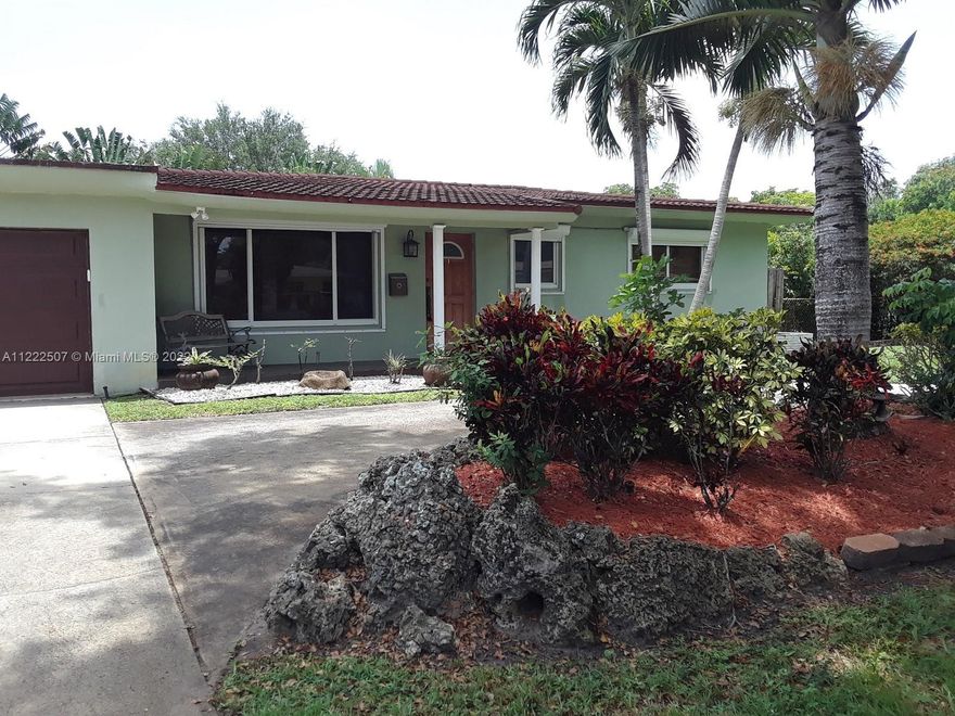 Amazing updated 3 bed/3 bath 2 car garage SF home in Plantation Gardens, a clean, & no HOA neighborhood! Very well maintained: Generac 20KW back-up power system, 2 central A/C & ceiling fans, PGT impact windows & doors, Rolladen remote control rolling shutters. Kitchen upgraded w/ newer cabinets, granite counters, stone backsplash & SS appliances. Travertine tile. Oversized renovated master bedrm & guest bath (almost like 2 master suites). Gas stove & water heater, gas grill & BBQ. Huge wrap-around screened patio area w/ Koi pond. Attractive barrel tile metal roof, large private fenced back yard & storage shed.  Home shows pride of ownership, a must see! Close proximity to shopping, beautiful Plantation Botanical Gardens & less than 10 miles from famous Ft. Lauderdale Beach.