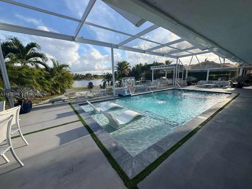 Owner ready to make a deal! Beautifully remodeled home situated on an oversized 17,500 SF corner pie-shaped lot with serene views of the pool and lake. This property was completely renovated with permits in 2019, including new electrical system, A/C with new ducts and vents, complete plumbing, roof, flooring, modern kitchen with updated appliances, renovated bathrooms, and new drywall throughout the home. The open floor plan offers comfortable living and great space for entertaining. The layout features three bedrooms and two bathrooms on one side of the home, while the opposite side includes an additional bedroom or office with its own exterior entrance and a full pool/guest bathroom, ideal for guests, in-laws, or a private workspace. The large lot provides plenty of outdoor space along with ample parking and includes an exterior electric vehicle charging station. Enjoy relaxing pool and lake views from your backyard in this spacious and thoughtfully designed property. A must see! Home is owner occupied (Owner/Agent). Showings by appointment only.