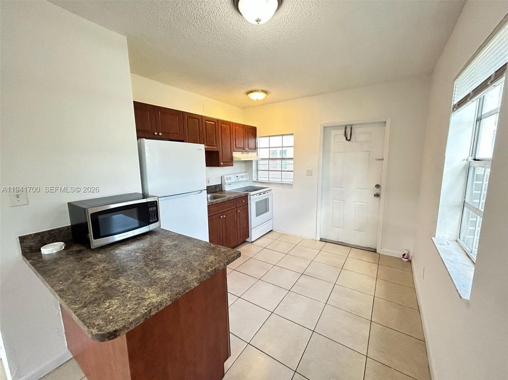 Photo of 990 Phippen Waiters Rd, Dania Beach, FL 33004 (MLS # A11941700)