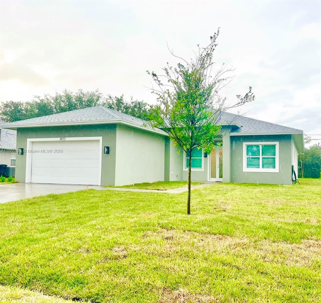 Photo of 1013 SW Deauville Ave, Port St Lucie, FL 34953 (MLS # A11885434)