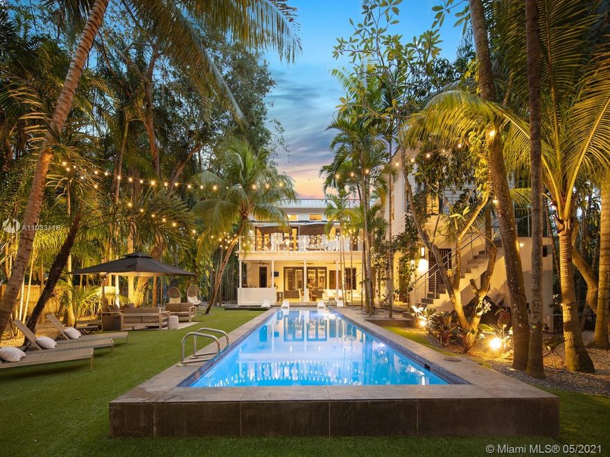 This enchanting tropical paradise is a true hidden gem, located in N Pinecrest & enveloped by exotic green grounds on a 31,363-sf lot. This gorgeous 6,485 sq.ft courtyard custom home features an open flrplan w/ volume ceilings, chef’s dream kitchen w/ Thermador appl, wine cooler, walk-in pantry, & family rm w/ entertainment bar. Lavish master ste located upstairs offers a spacious setting w/ sitting area, spa like bath, walk-in closet & open balcony. Off master ste find a 2nd level rec room/gym w/ private entrance. Discover the ultimate indoor/outdr living experience w/ resort-style pool, tanning ledge, large covered terr, built-in summer kitchen & lush botanical garden. Add’l Features: 3 car gar, excellent Pinecrest location + schools. A unique home for those seeking the extraordinary.
