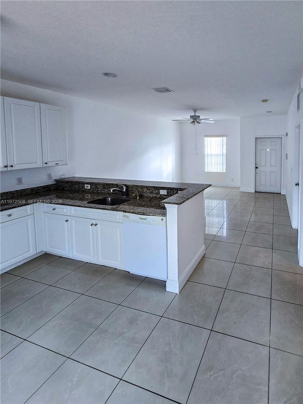 Photo of 4216 Leo Ln #2E, Riviera Beach, FL 33410 (MLS # A11972508)