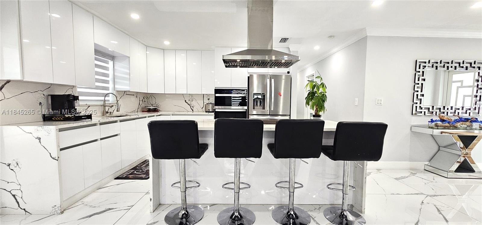 Turnkey beauty with income potential! This fully remodeled gem is move-in ready and packed with upgrades - from plumbing to a sleek metal roof, impact windows and doors, and a Titan water heater. Spacious layout with room on both sides of the property - perfect for parking a boat or RV. The large backyard has plenty of space for a pool, and the stunning driveway adds extra charm. The home offers great income-generating potential! Call listing agent for details. Don’t miss the opportunity to own this jewel!