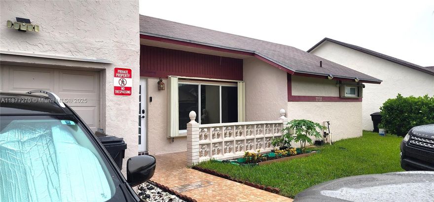SELLER HIGHLY MOTIVATED!!!Beautiful 3/2 home with private backyard for entertainment with mango tree. Immaculate kitchen countertop update with cherry wood cabinets. A new stainless steel refrigerator less than a year old with a brushed nickel kitchen faucet. Home is equipped with water filter system and security camera all round. New impact front door and impact windows on front and side windows. Garage used as a utility and laundry room. Updated electric panel with Hurricane shutters all around. Split floor plan. Newly updated 2nd Bathroom.