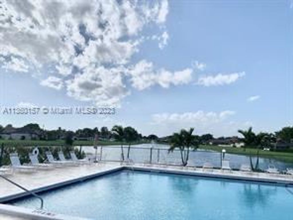 Photo of 9677 Boca Gardens Pkwy #A, Boca Raton, FL 33496 (MLS # A11360157)