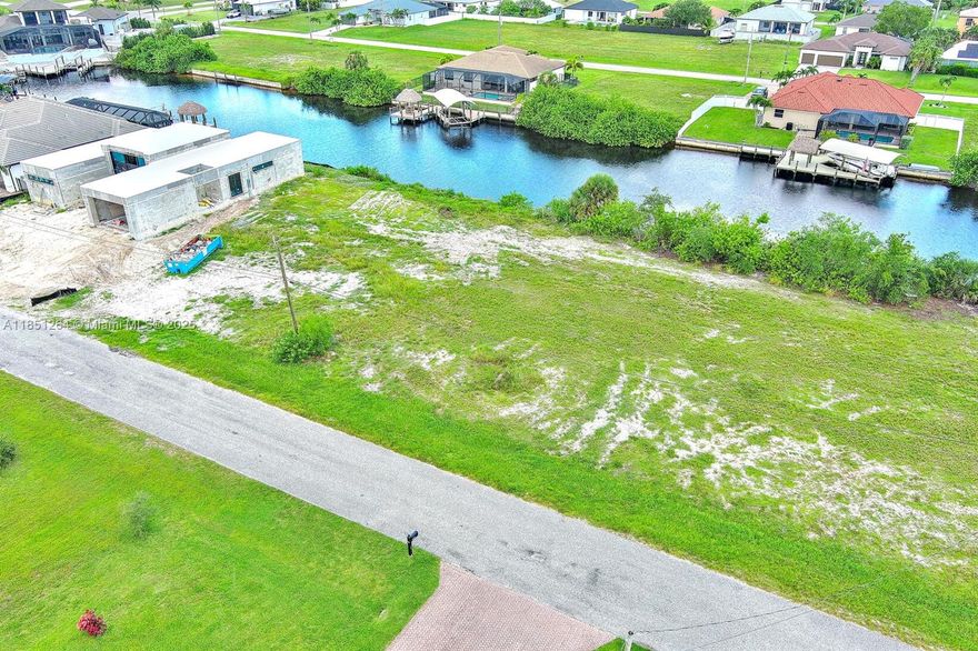 Exclusively presented by Sunland Real Estate: Build your dream home on this Premium Waterfront Vacant Lot in NW Cape Coral! An exceptional 0.23-acre waterfront lot located in one of Cape Coral's most sought-after neighborhoods. Whether you're a homeowner ready to build your dream residence or an investor looking to capitalize on Cape Coral's booming growth, this property offers unbeatable potential. This buildable lot is surrounded by newer homes and is just minutes from Tropicana Parkway, Burnt Store Road, Coral Oaks Golf Course, and the City's expanding infrastructure.