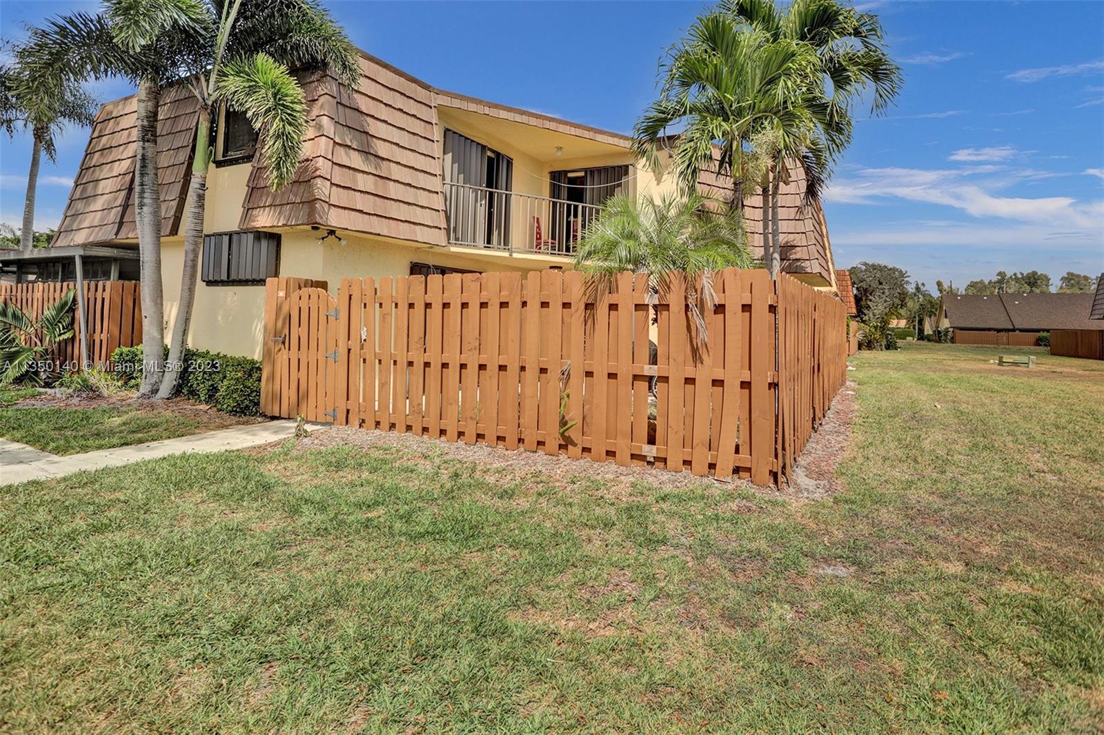 Peaceful subdivision, this Townhome is overlooking the lake and green area. Accordion Shutters, tiled patio fenced. 2 bedrooms and 2 bathrooms on second floor with balcony access, laundry room and 1/2 bath on first floor, new washer & dryer, Springdale Homes have a Club House, tennis, Pool, 2 assigned parking spaces, plus guest parking.
