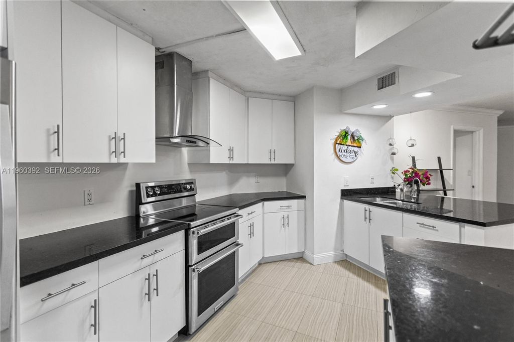 Photo of 10401 W Broward Blvd #111, Plantation, FL 33324 (MLS # A11960392)