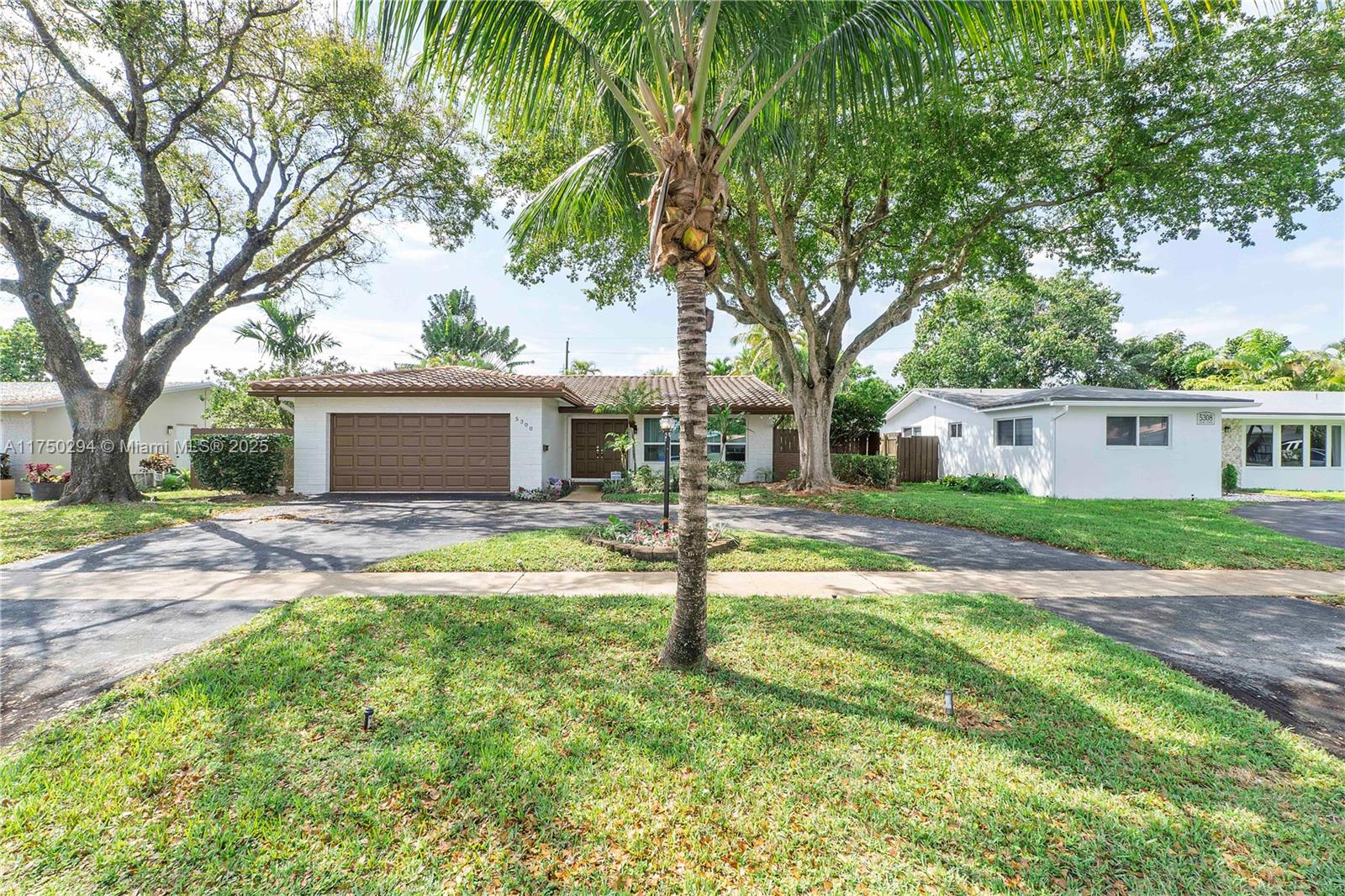 This lovely Hollywood Hills home is 3 bedrooms, 2 baths, 1,879 SF on an oversized 9,003 SF Lot. Just 5 miles from Hollywood Beach and Broadwalk. Remodeled in 2007 with a solid oak kitchen an open floor plan and well maintained with continued upgrades. Recently painted interior/exterior. Some features include a 2-car garage, storage shed, custom tile throughout, solid oak baseboards, impact windows and doors, one year old AC unit & Hot Water heater, burglar alarm, fire monitoring system and doggie doors. The perfect home for entertaining! Enjoy the custom-built oversized pool, lushly landscaped and fully fenced private backyard. Walk to Zinkil park and Orangebrook elementary. Perfectly located with easy access to Florida Turnpike, I-95, Fort Lauderdale and Miami airports.