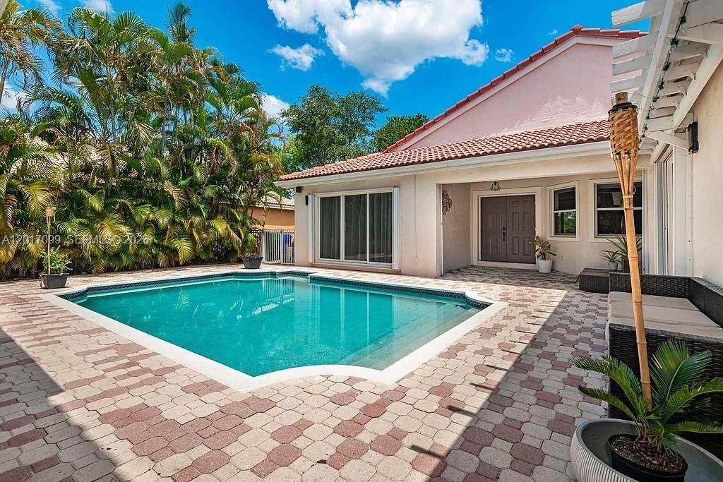 Photo of 19871 SW 3rd Pl, Pembroke Pines, FL 33029 (MLS # A12017099)