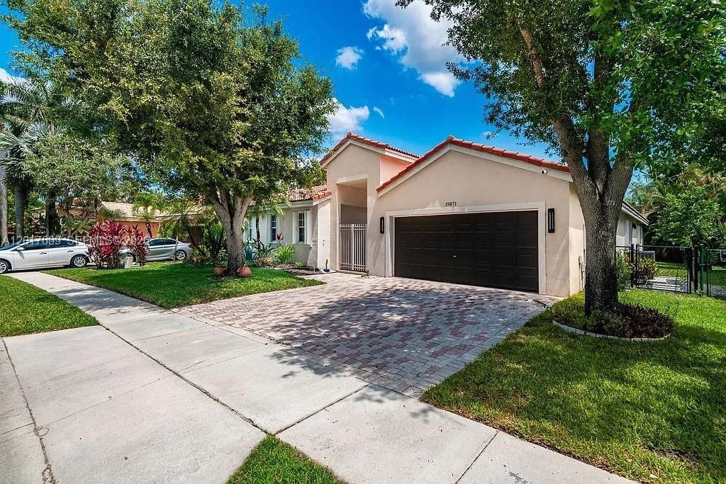 Photo of 19871 SW 3rd Pl, Pembroke Pines, FL 33029 (MLS # A12017099)