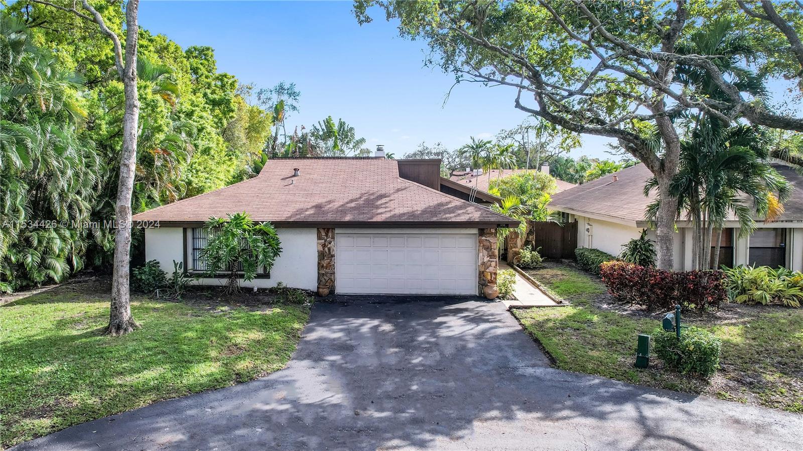 Great pool home located in the desired neighborhood, The Woods of Emerald Hills. Home features 4 bedrooms 2.5 baths, beautiful ceramic floors, french doors, wood burning fire place, solar panels, vaulted wood beam ceiling, newer A/C (2022), tankless water heater & two car garage. Interior freshly painted. Rarely available. Close to Fort lauderdale International airport, Hollywood Beach, major expressways, Hard Rock, parks, shopping, dining, schools & worship. Home has two power walls manufactured by Tesla .