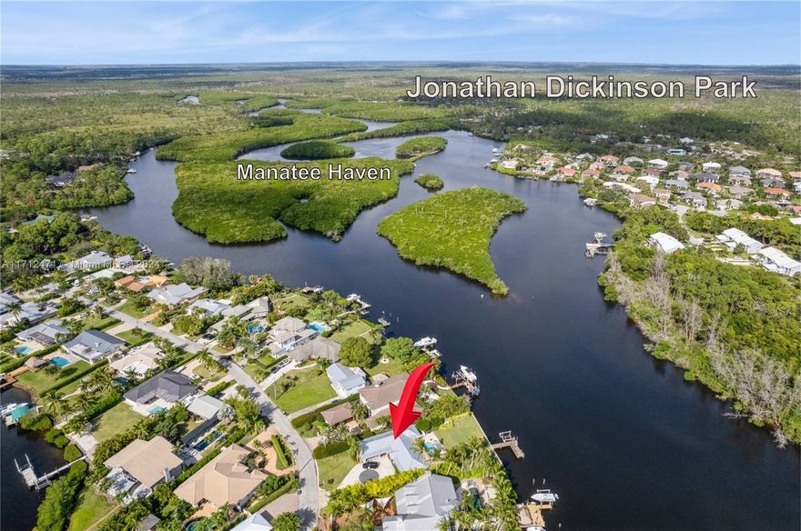 A Jupiter address in Martin County (lower taxes) & no HOA.  Fully renovated CBS home with 100 FEET on the Loxahatchee River ~2.3 miles to the Jupiter Inlet.  Hurricane impact doors & windows.  Private preserve views & both neighbors are hidden behind beautiful trees & hedges.  2013 seawall, 10,000lb boat lift, a jet ski lift, heated pool with a cabana bath, 27KW generator (500 gallon propane tank), marble pool deck, tiki hut with outdoor TV, 2020 energy efficient metal roof ($70K), 2020 AC, gas kitchen range, tankless water heater & a dog bath.  Take your jet ski or kayak to Jonathan Dickinson Park to see the manatees.  Priced the same as an Oct 29, 2024 sale 3 doors down -- SEE PHOTO #3.   This one won't last long.
