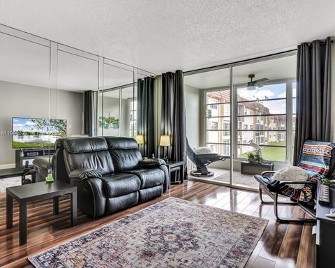 Photo of 2741 N Pine Island Rd #208, Sunrise, FL 33322 (MLS # A11960393)