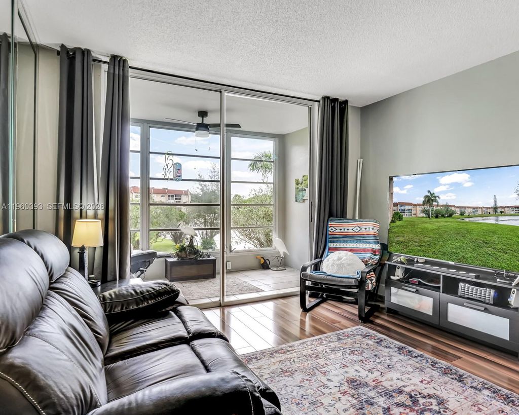 Photo of 2741 N Pine Island Rd #208, Sunrise, FL 33322 (MLS # A11960393)