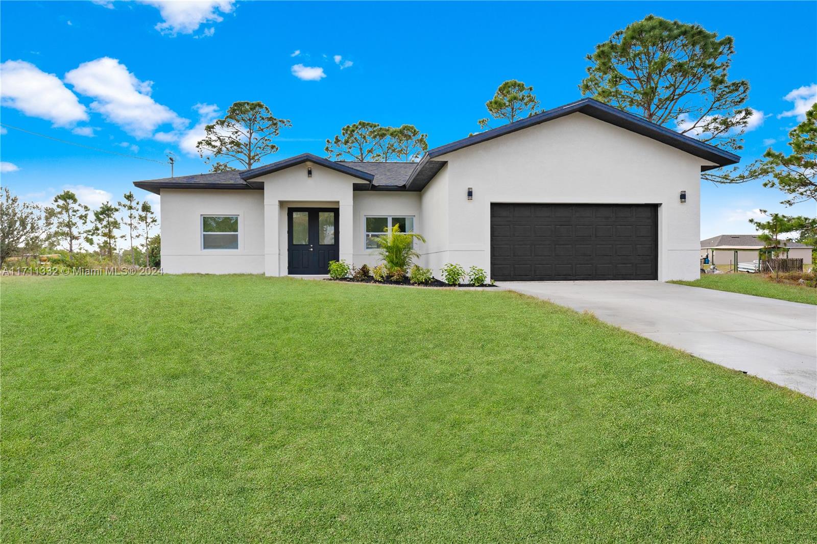 BRAND NEW HOME. in one of the most desirable areas of Lehigh Acres... Amazing home in one of the most desirable areas of Lehigh Acres. Close to 82 Highway. Property consist of 10 foot high ceilings , Impact windows and doors, Open concepts with split floorplan, kitchen offers plenty of Black shaker cabinets and counterspace, Quartz countertops, brand new SS Appliances, sliding glass doors open to the beautiful back yard to enjoy the Florida weather. The master bedroom has shower plus a separate tub, laundry room near kitchen,back yard has plenty room for pool.