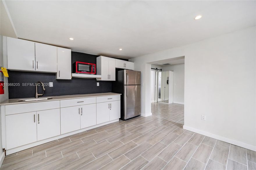 Modern and private 1-bedroom studio located at 10459 SW 157th Terrace, offering a clean, contemporary design in a quiet, family-friendly neighborhood. This well-maintained unit features a stylish kitchenette with sleek cabinetry, stainless steel appliances, and modern finishes throughout, complemented by beautiful tile flooring and recessed lighting. Enjoy your own private entrance with a fenced side yard and finished walkway, perfect for added comfort and privacy. Ideally situated between Palmetto Bay and Cutler Bay, just minutes from shopping, dining, and major roadways. Conveniently located near Zoo Miami, Black Point Marina, Coral Reef Park, Pinecrest Gardens, the historic Deering Estate, Fairchild Tropical Botanic Garden, and Biscayne National Park. A perfect blend of modern living and prime location!