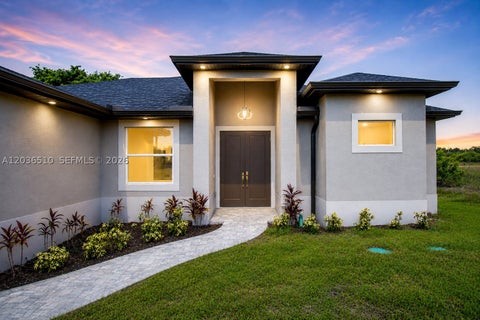 Photo of 804 Curtis Ave N, Lehigh Acres, FL 33971 (MLS # A12036510)