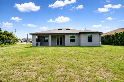 Tiny photo for 804 Curtis Ave N, Lehigh Acres, FL 33971 (MLS # A12036510)