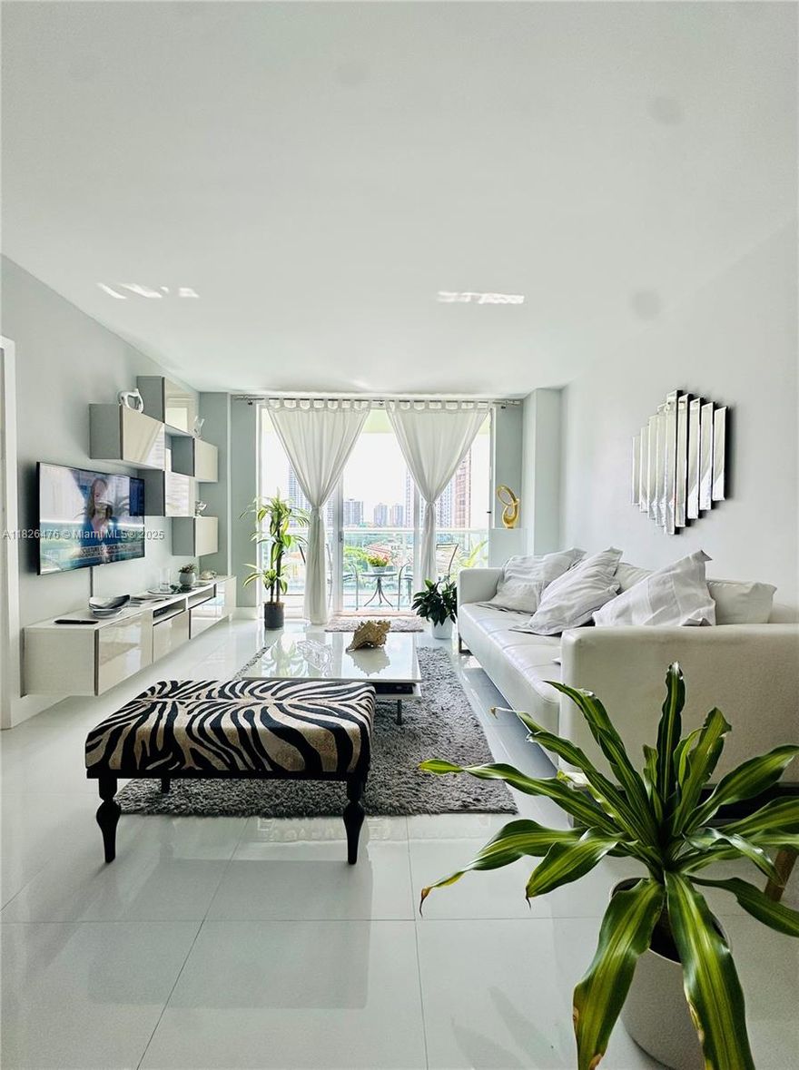 Beautifully renovated bright and spacious residence with unobstructed intracoastal and city view across the street from the Atlantic Ocean. Unit has been completely remodeled into a 2 bedroom with plenty of closet space. Apartment features brand new open kitchen, new bathroom, large white porcelain flooring, built-in walk-in closets, cooking island with quartz countertop, Italian kitchen cabinetry, large white porcelain throughout and Washer/Dreyer inside. Apartment has been tastefully decorated and is being sold fully furnished. Located in a full service building with lots of services and amenities which include: 24-hr security, valet, fitness center, swimming pool, tennis, business center, BBQ area, on-site cafe, play room and more. Unit comes with one assigned covered parking.