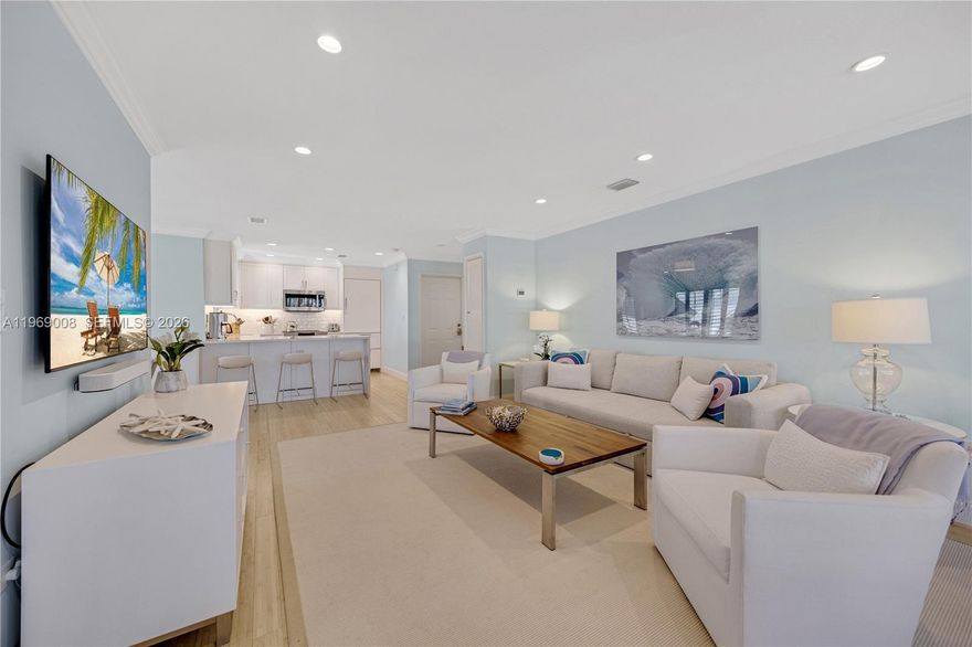 Fantastic waterfront condo in Pumpkin Cay neigborhood. This bright and spacious 2BR/2BA corner residence is filled with natural light and showcases water views from every angle. The recently remodeled kitchen features white custom cabinetry, Bosch stainless steel appliances, and a built-in refrigerator. Just off the kitchen, a dedicated bar/wine area with glass cabinetry and a wine fridge to make entertaining effortless. Additional highlights include two-zone HVAC, two on-demand water heaters, impact windows, and more. Enjoy new seawall with floating dockage for up to a 40’ boat (subject to availability) just steps away, plus a private cart storage room—ideal for your golf cart, fishing gear, and extras. Move-in ready—schedule your private showing today!