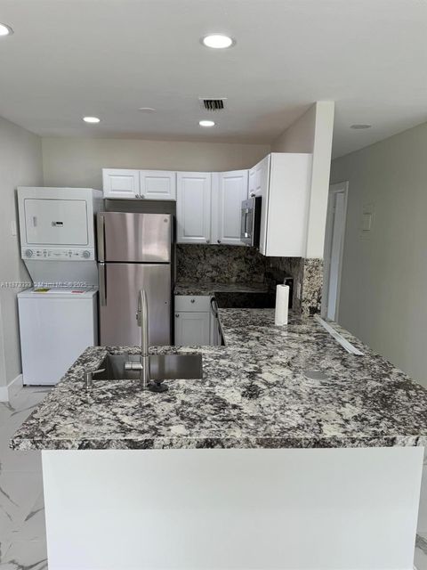 Photo of 1050 NW 25th Way, Fort Lauderdale, FL 33311 (MLS # A11873333)