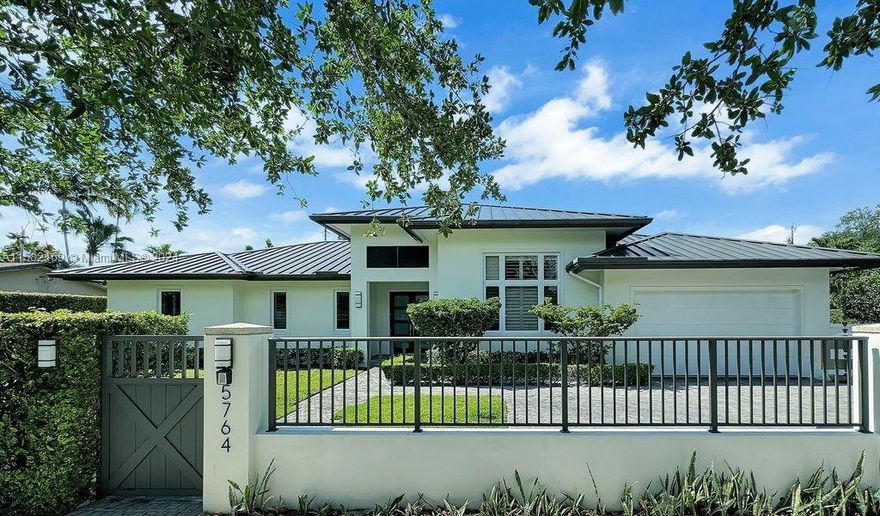 Accepting Back Up Offers! Stunning "Modern Farmhouse" architectural style in premier neighborhood. Custom built in 2014, this contemporary, warm family home is situated on a 16,500 sq. ft. lot. Property includes 3 lots, house sits on 2 lots and 3rd is potentially buildable. Great open floor plan, spacious living area has 15' ceilings with 10' ceilings in rest of house. Abundant natural light pours in thru oversize windows fitted w plantation shutters, oversize Italian porcelain tile, engineered wood in bedrooms, high end bath fixtures, open kitchen has top of line appliances, gas range, quartz countertops, covered patio/terrace, saltwater pool surrounded by keystone deck. Metal roof, 2-car garage. Great location, blocks from U of M, Whole Foods, Sunset area shopping! Superb property!