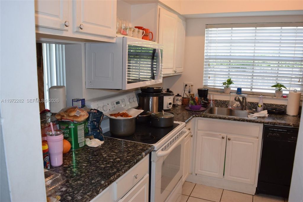 Photo of 2391 NW 96th Ter #19M, Pembroke Pines, FL 33024 (MLS # A11972282)