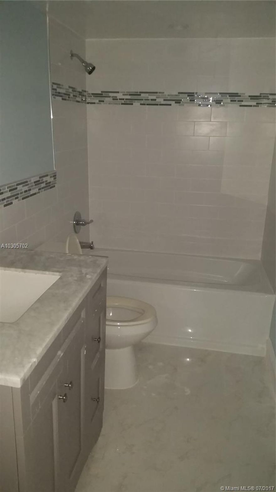 Stunning 2 bed 2 bath. Brand new kitchen and bathrooms. High end finishes. Tastefully renovated. Secure building centrally located next to houses of worship shopping and highway.