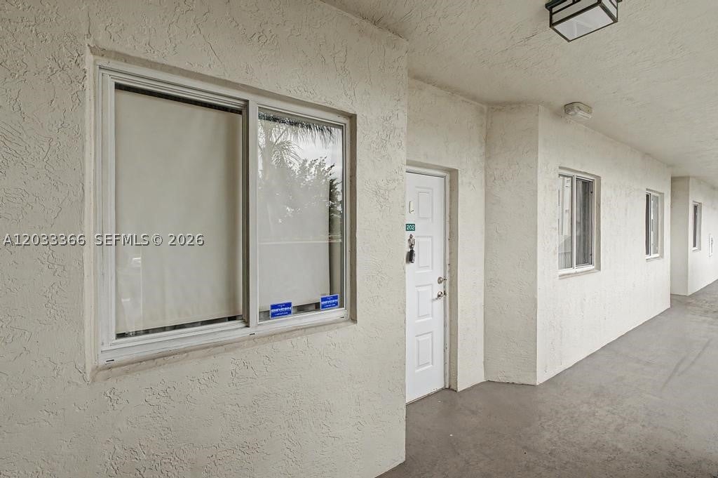 Photo of 7727 Southampton Ter #202, Tamarac, FL 33321 (MLS # A12033366)
