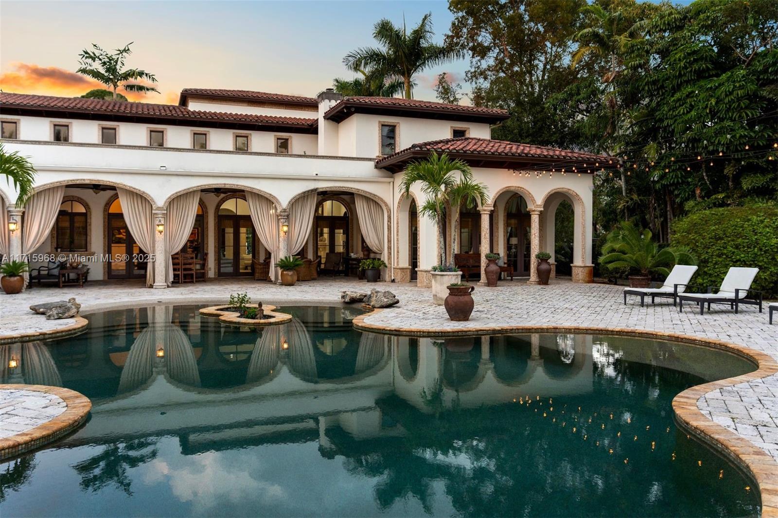 Presenting Villa del Sol on historic Hardee Drive in South Miami. With over 8000 SF, the residence features 7 bedrooms & 7.5 bathrooms on a perfect acre lot. Upon entering, guests are greeted by high ceilings, custom built-ins, & marble floors highlighted by large windows & natural light. The chef's kitchen is a culinary haven, equipped with breakfast bar, butlers pantry, & top appliances. Detailed millwork & gallery walls lead to a sumptuous Primary Suite overlooking the gardens. The covered terraces open to a true oasis with lagoon style pool, putting green, game room & gazebo completing the perfect setting for family gatherings & celebration. 4 Car Garage. Don't miss the chance to make this magnificent property yours. Schedule a showing today & step into a world of refined living.