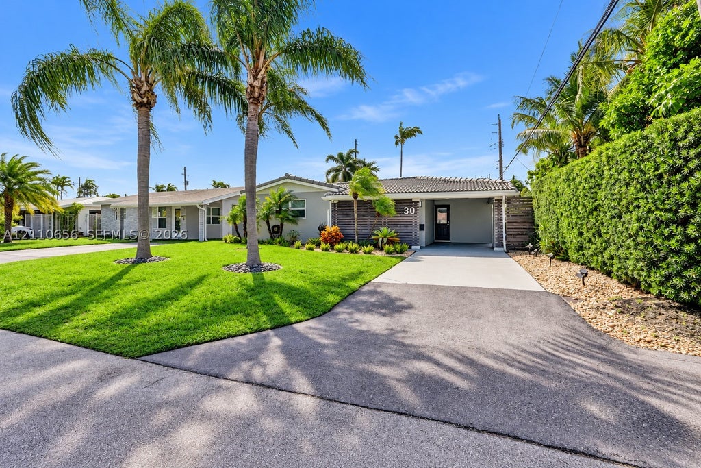 Photo of 30 NE 48th Ct, Oakland Park, FL 33334 (MLS # A12110656)