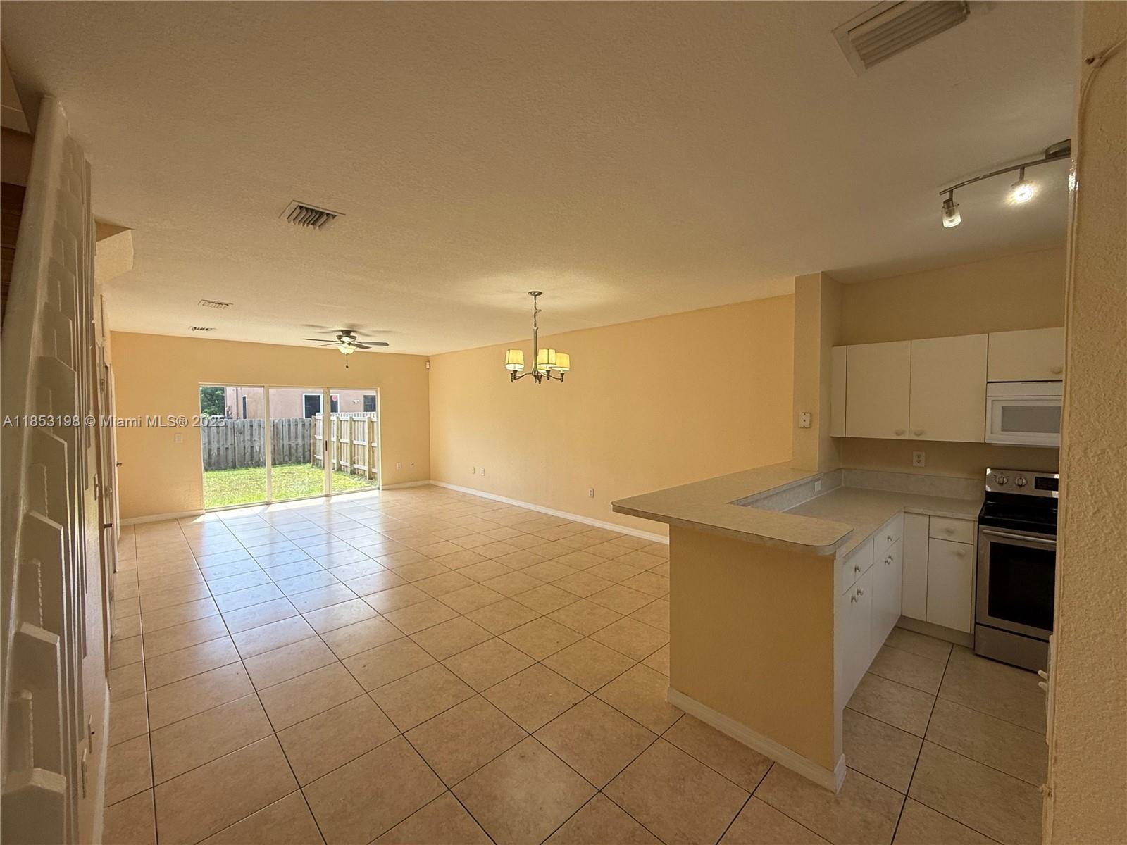 Beautiful two-story townhouse with 3 bedrooms, 2.5 bathrooms, with tiled floors in the living areas and wood flooring in bedrooms. The bright living room overlooks a private fenced backyard, perfect for relaxation. Modern kitchen includes stainless steel appliances, granite countertops, and ample storage. A full-size washer & dryer are included. The primary suite has an en-suite bathroom, while the additional bedrooms share a well-appointed bath. Enjoy private parking, a secure community, and small pet-friendly policies. Conveniently located near major highways, shopping, and dining. ASSOCICATION APPROVAL PROCESS TAKES 3 WEEKS , $100 APP FEE.