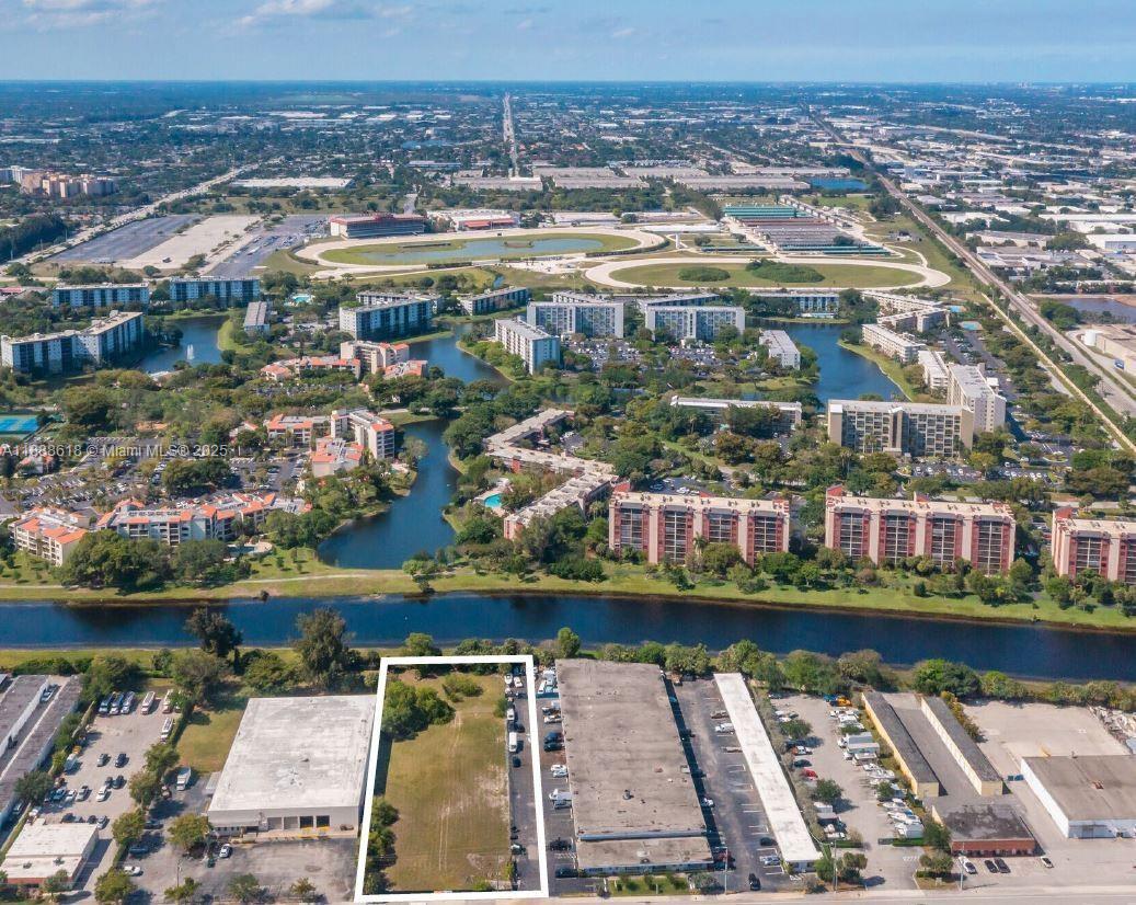 Exceptional 1.32-acre industrial lot in Pompano Beach, fully fenced and situated within a General Industrial Zone. Site plan approved for a modern facility with 8 bays and office space. The layout is designed with flexibility in mind bays and offices can be combined or adjusted to create larger work areas or customized configurations to suit your needs. Zoning allows a wide range of industrial uses including manufacturing, distribution, and logistics. This secure and expansive site offers a prime opportunity to establish or expand operations in a thriving business corridor. With strong demand for commercial space in the area, this property is a rare opportunity for developers or investors. Don’t miss it!