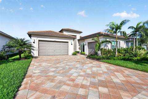 Photo of 12046 SW Laguna Bay Pkwy, Port St Lucie, FL 34987 (MLS # A12086926)