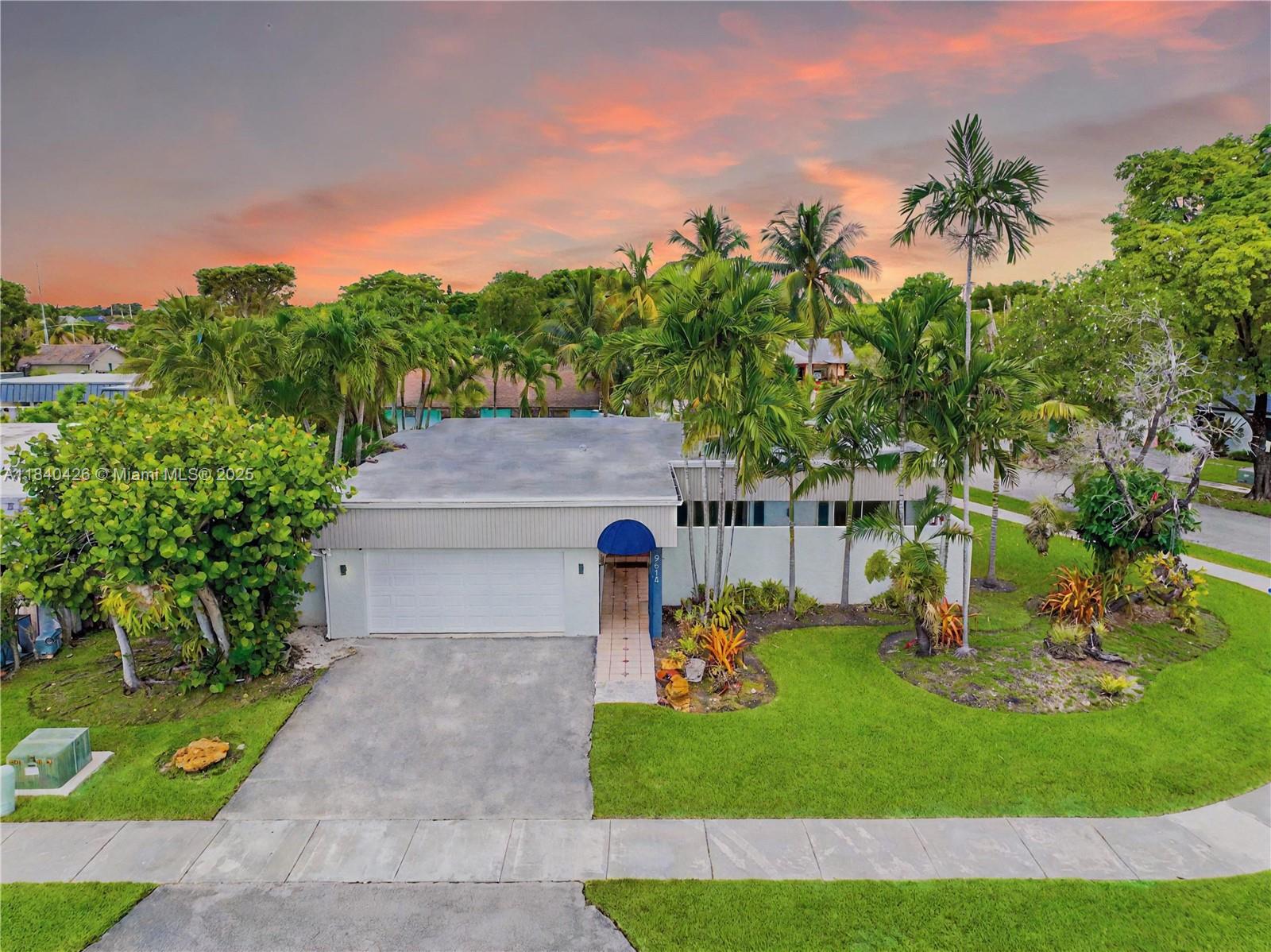 Stunning single-family home with a pool on an oversized corner lot in the desirable Calusa neighborhood. The property features 4 bedrooms and 2 bathrooms. This updated home highlights an open layout seamlessly connecting the living, dining, family, and kitchen areas. Sleek tile floors, LED recessed lighting, and sliding doors in every room for seamless indoor-outdoor living. The modern kitchen includes new appliances with a cooking island. The 4th bedroom, a converted garage with a private entrance, is perfect as an in-law suite, office, or rental. The tropical backyard oasis offers lush landscaping, a concrete privacy wall, an enclosed courtyard, a heated pool, a jacuzzi, and an automated irrigation system. Minutes from the Turnpike and in an A+ school district. Enjoy the 3D tour!